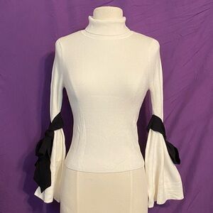 Maeve Ivory Turtleneck Blouse with Black Ribbon Ties. Size XSP.